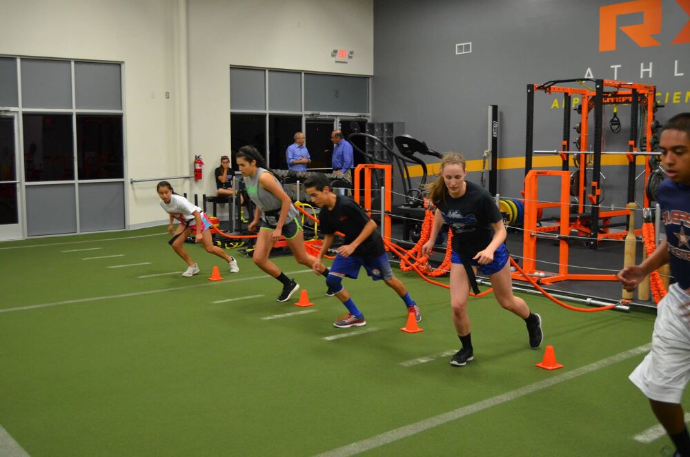 Young athletes working on speed and agility at Fyzical Athletics